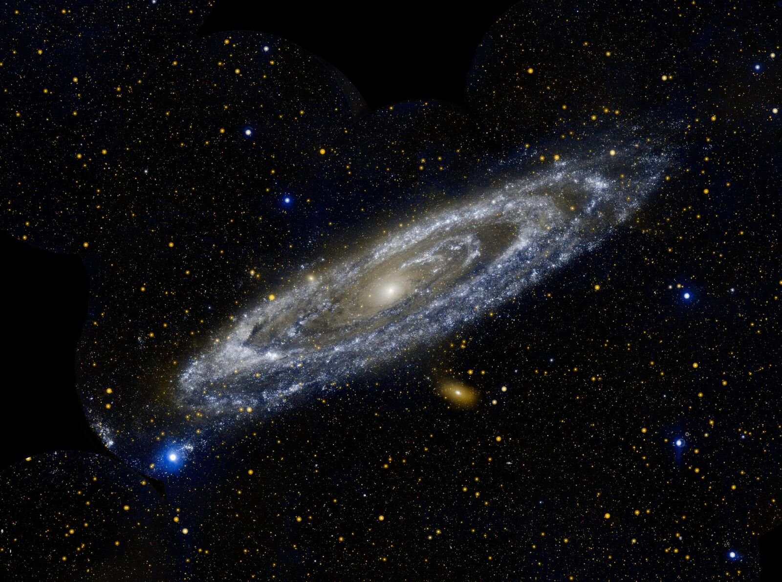 A Galáxia de Andrômeda, uma espiral inclinada de azul e dourado, cercada de estrelas
